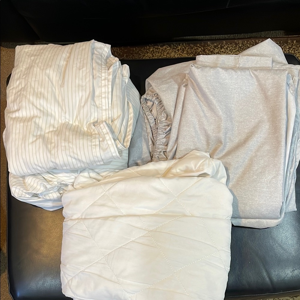 2 Sets of Twin XL Sheets and a Mattress Pad 2-fitted 2-flat
